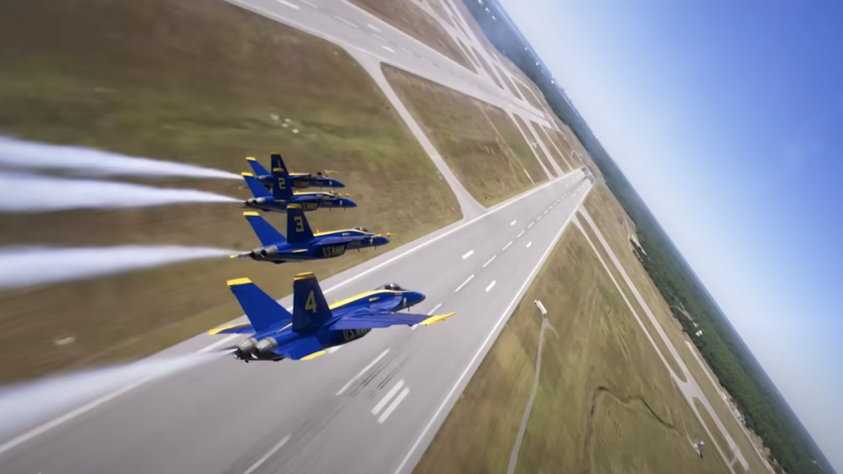 Blue Angels flying over runway